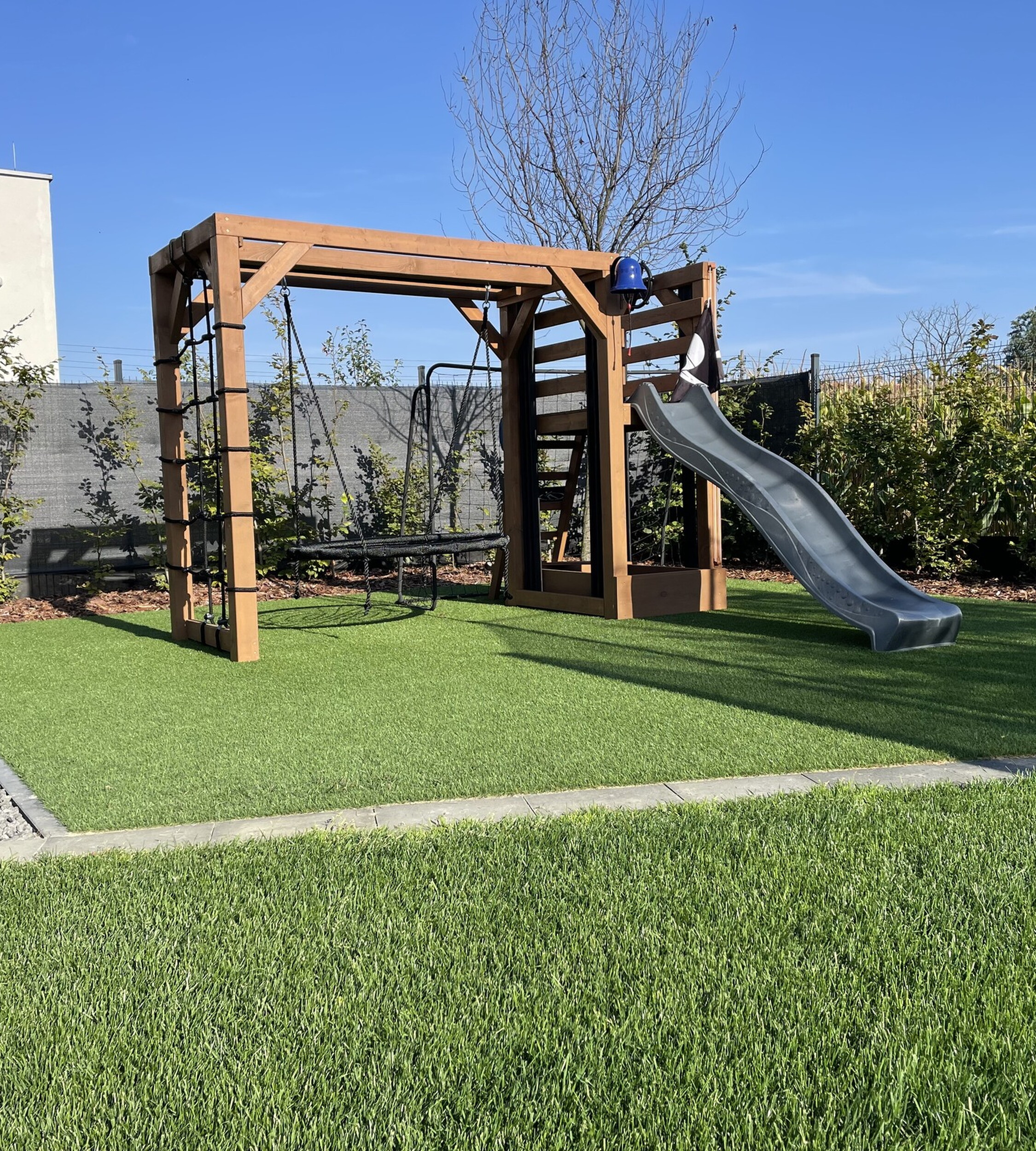 Artificiall grass for safe and fun slide areas